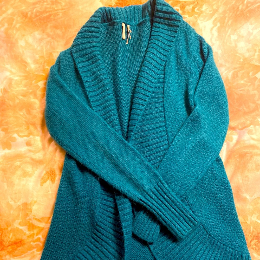 Dark teal sweater.